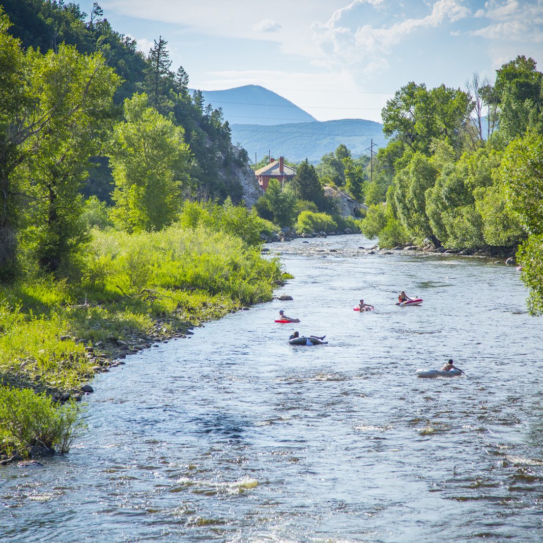 Family and Friends Tubing Down Yampa River in Steamboat Springs Colorado