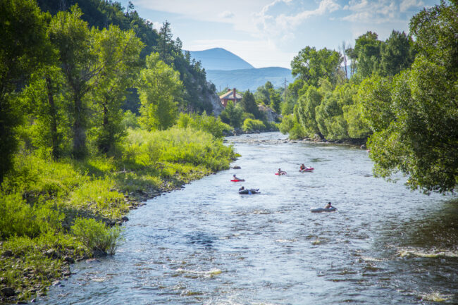 Family and Friends Tubing Down Yampa River in Steamboat Springs Colorado