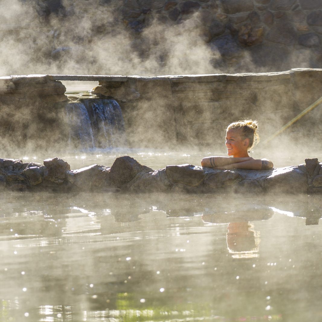 Strawberry Park Hot Springs in Colorado Lady in spring with steam