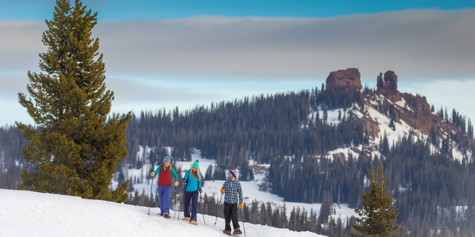 Family Snowshoeing on Steamboat Mountain during winter